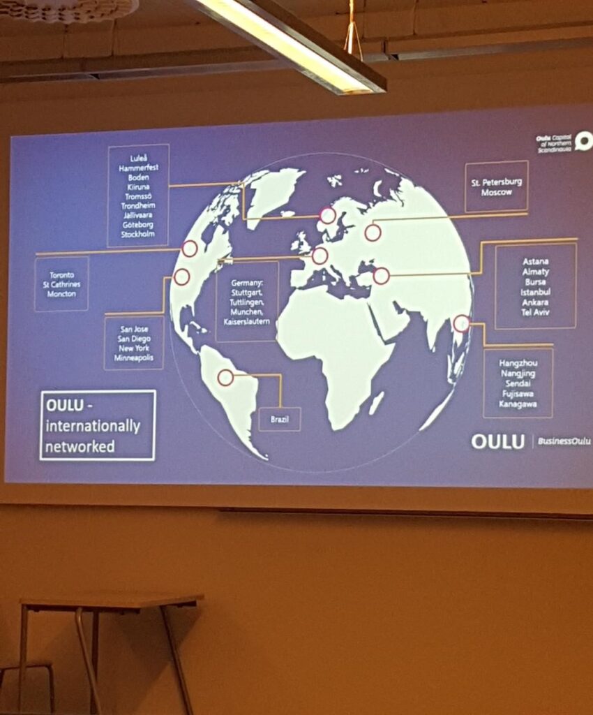 Slajd z prezentacji przedstawiający sieć współpracy międzynarodowej Oulu
